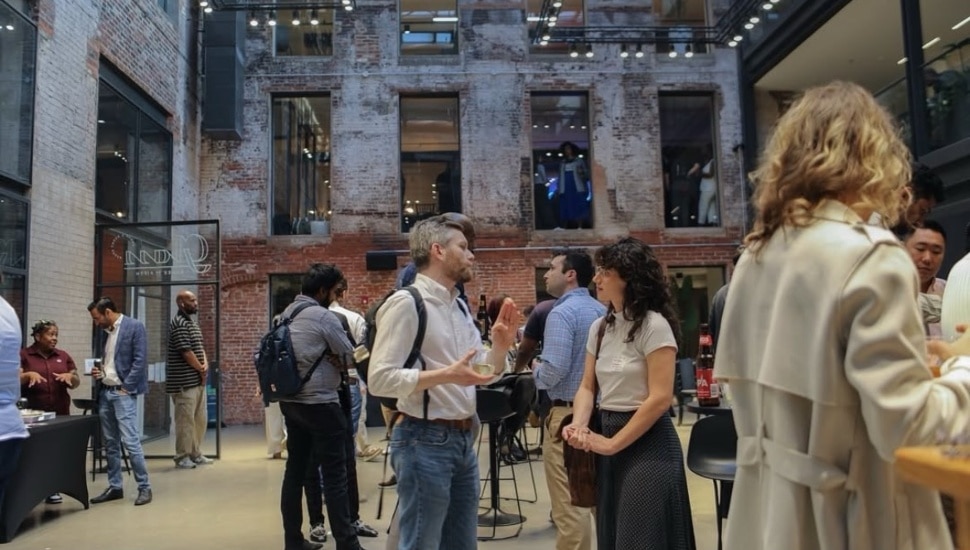People networking at a 1Philadelphia event.