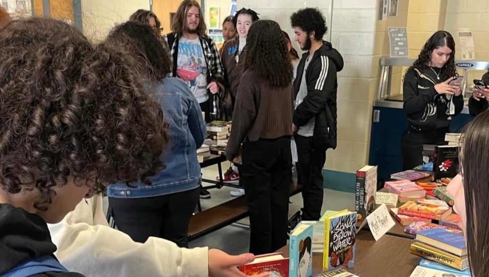 Students reading books.