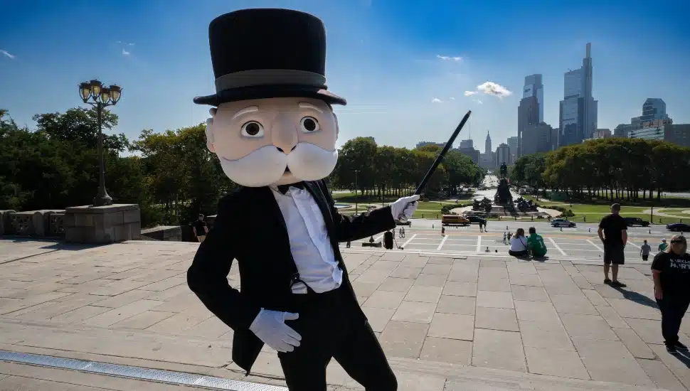 The Monopoly Man posing on the Rocky steps.