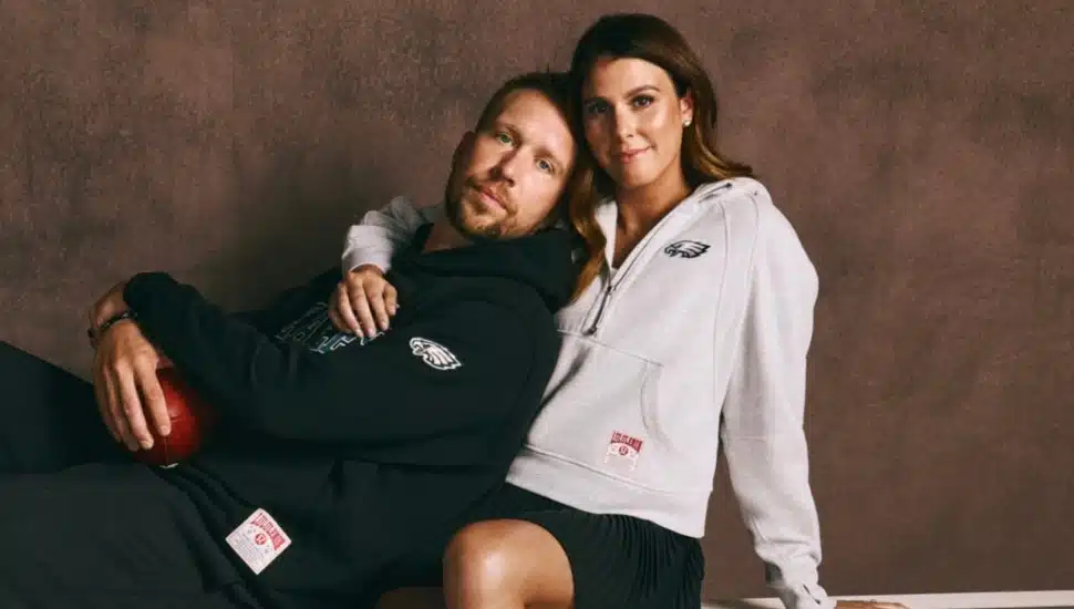 Nick Foles embraced by his wife, Tori, both of whom are wearing new Philadelphia Eagles gear from Lululemon.