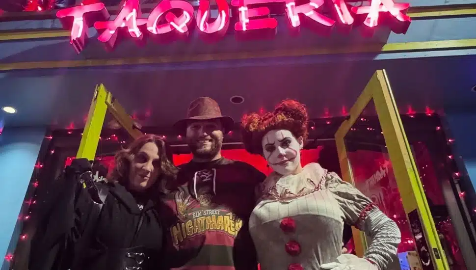 People in costumes outside Taqueria Amor in Manayunk.
