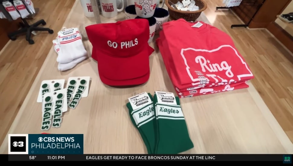 Phillies socks, hats, and shirts, along with Eagles memorabilia.
