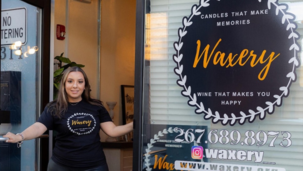 Crysal Ortiz standing outside her business, Waxery.