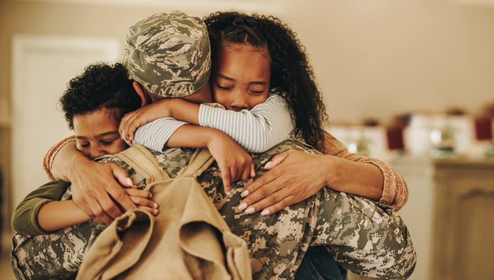 Military family embracing.