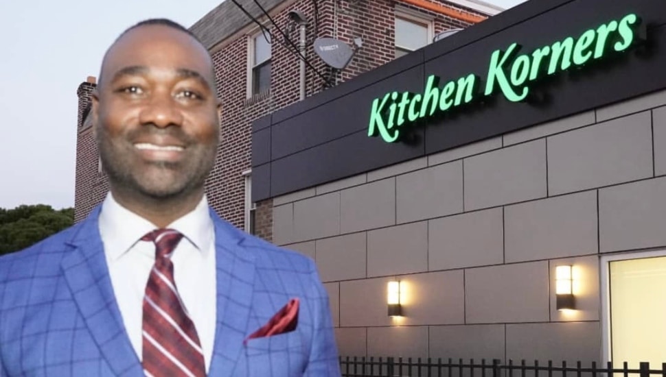 Alonzo Coates in front of Kitchen Korners facility.