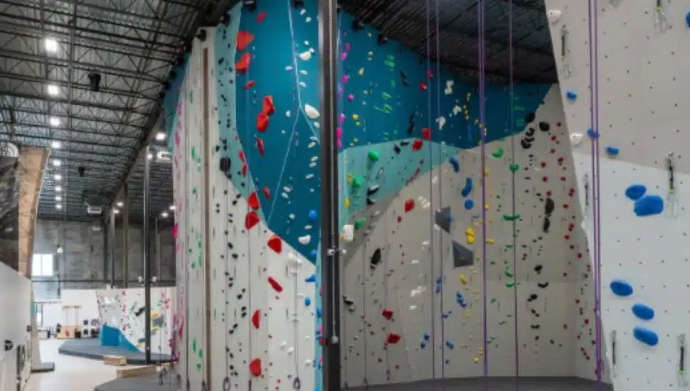 A rock climbing wall inside Movement Gyms.