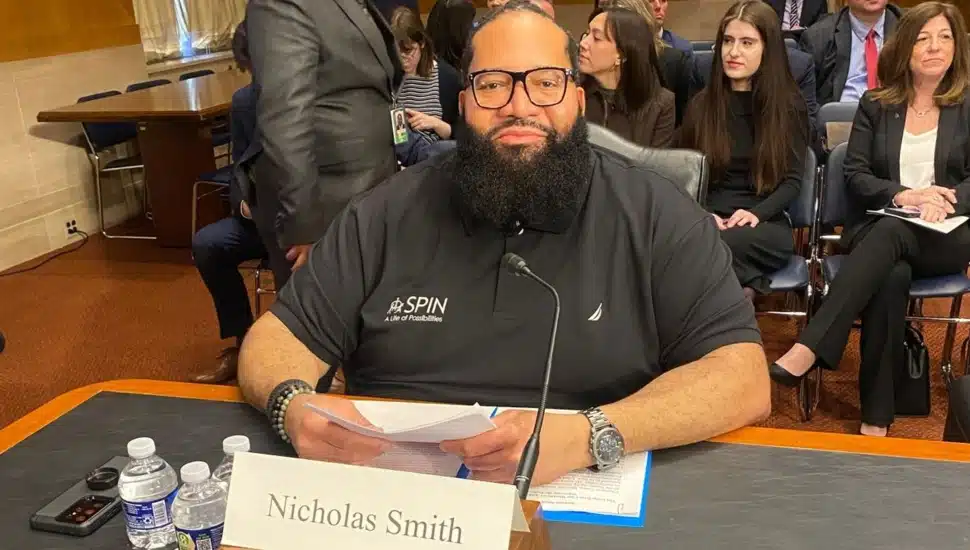 Man sits at desk and testifies before Senate committee.