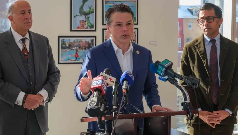 Congressman Brendan Boyle speaking at a podium.