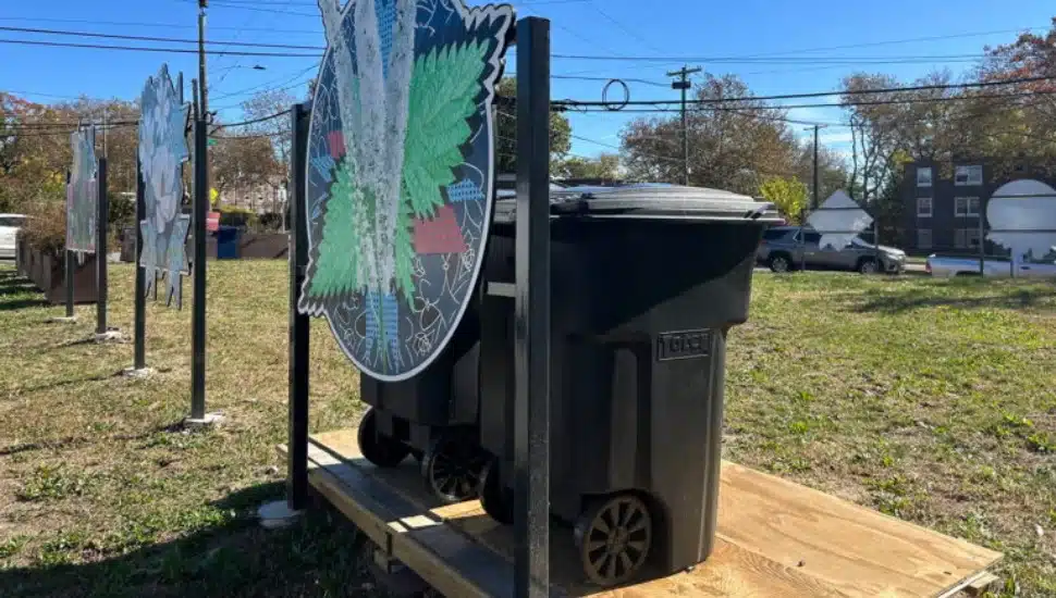 Two large trash cans at Empowered CDC’s first community waste disposal site on Elmwood Avenue in Southwest Philadelphia.