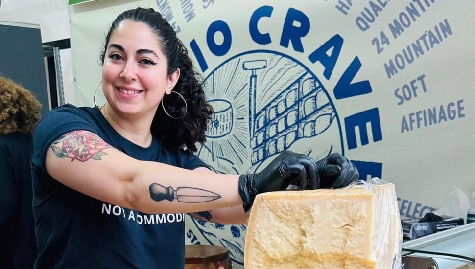 Emilia D'Albero with a block of cheese.