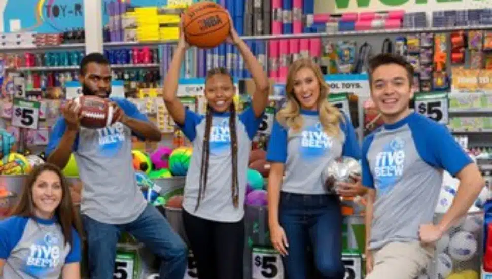 Five Five Below staff members inside store.