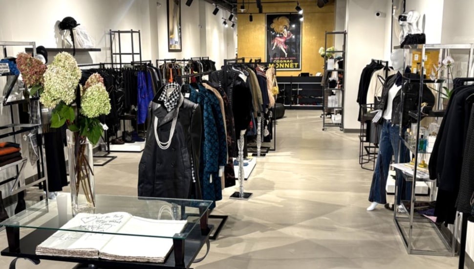 Inside a Joan Shepp store with many clothing selections.