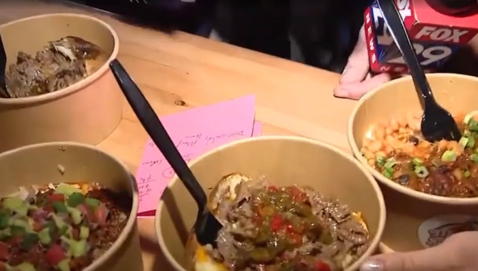 Four bowls of loaded potatoes.