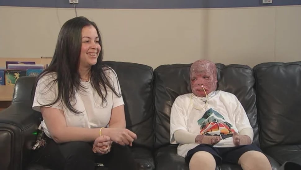 Ramesses Vazquez-Viana (right) with his mother Jamie Vazquez-Viana (left) on the couch.