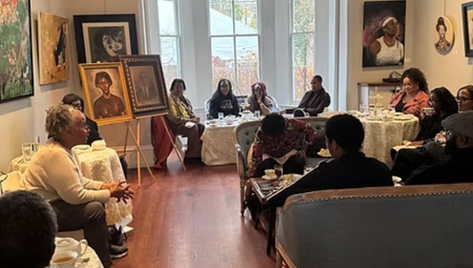 Black collectors talking surrounded by art.
