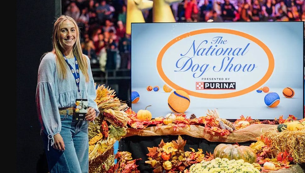 Lil Nagy stands by a display for The National Dog Show.