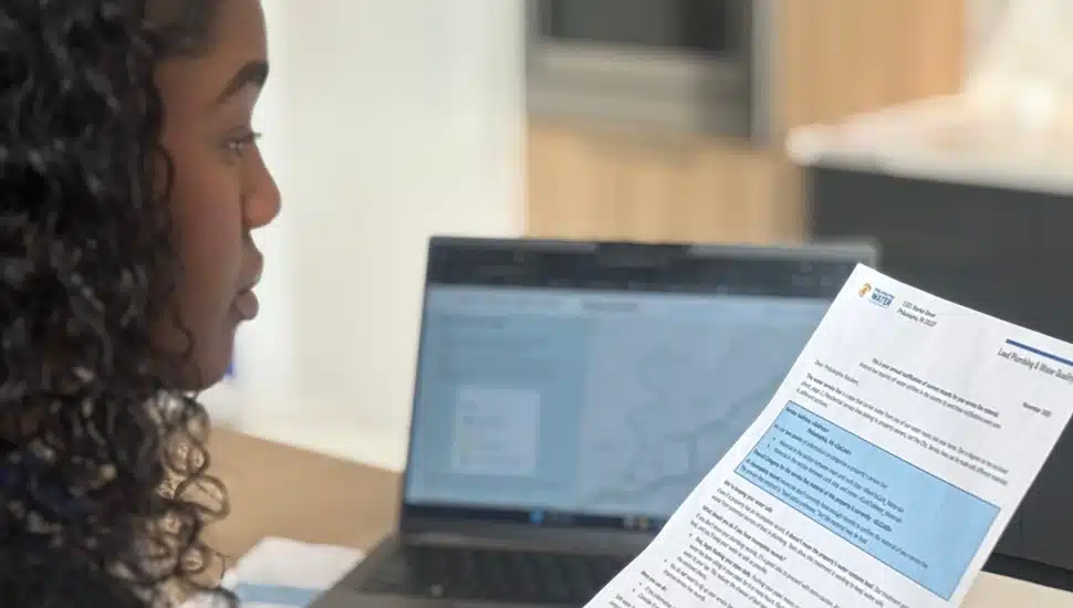 A women reading a PWD letter.