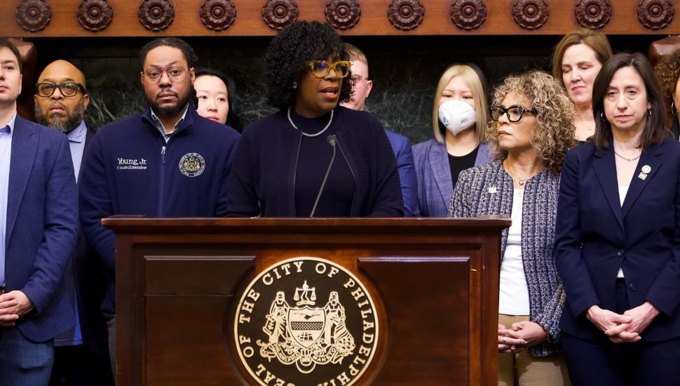 Cherelle Parker at podium with other local officials by her side.
