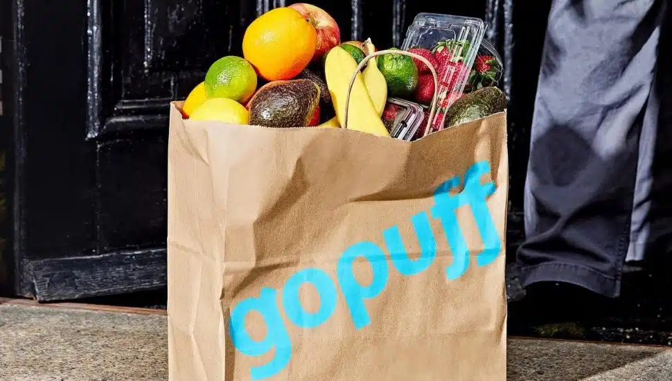 A Gopuff bag with bananas, avocados, strawberries, and more.