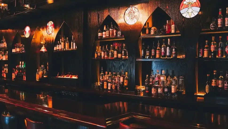 Inside Doom bar, with bottles, a bar countertop, and seating.