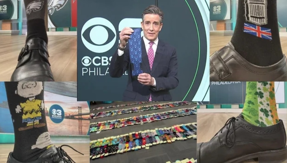 Jim Donovan showcasing many of his socks.
