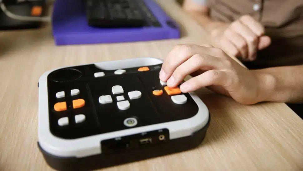 A hand using an audiobook.