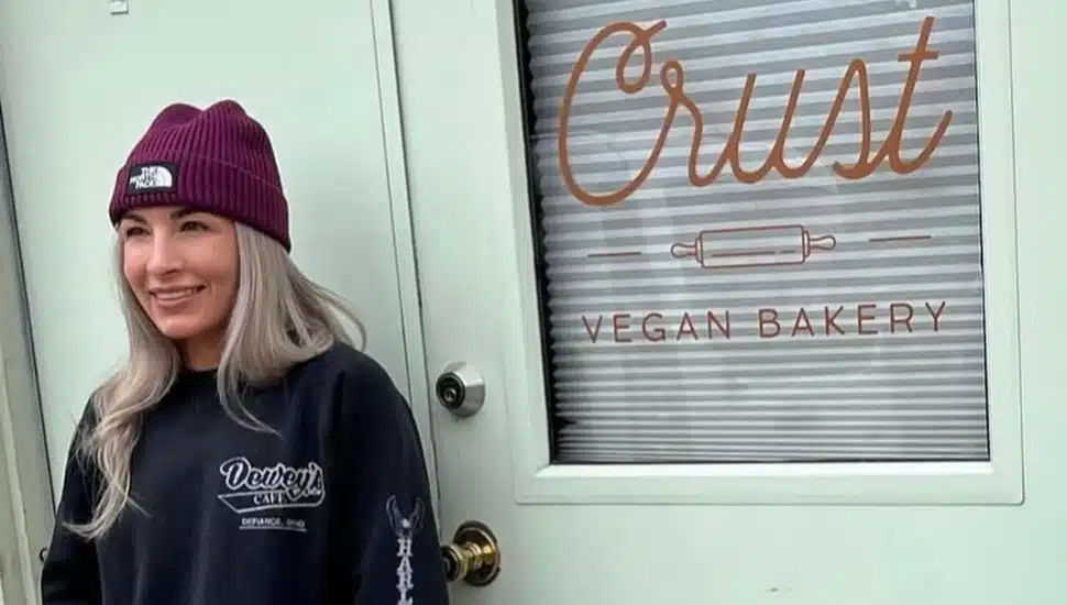 Meagan Benz standing outside Crust Vegan Bakery.
