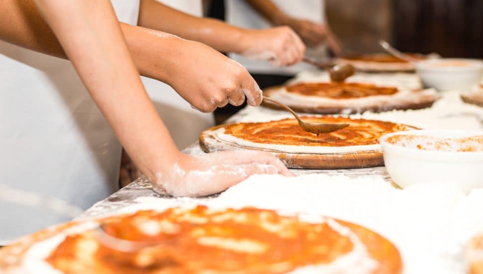 People making pizza.