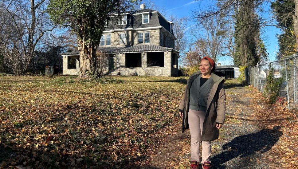 Autumn Nelson in front of 100-year-old home in Germantown.