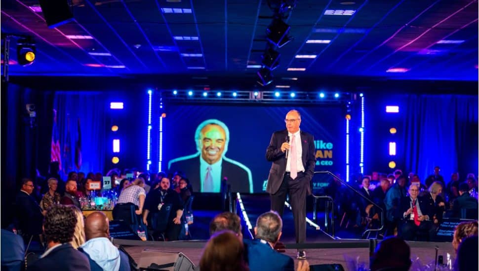 Mike Bowman, President and CEO of the Valley Forge Tourism & Convention Board, speaks on stage to an audience during a VFTCB event highlighting Montgomery County’s tourism strategy.