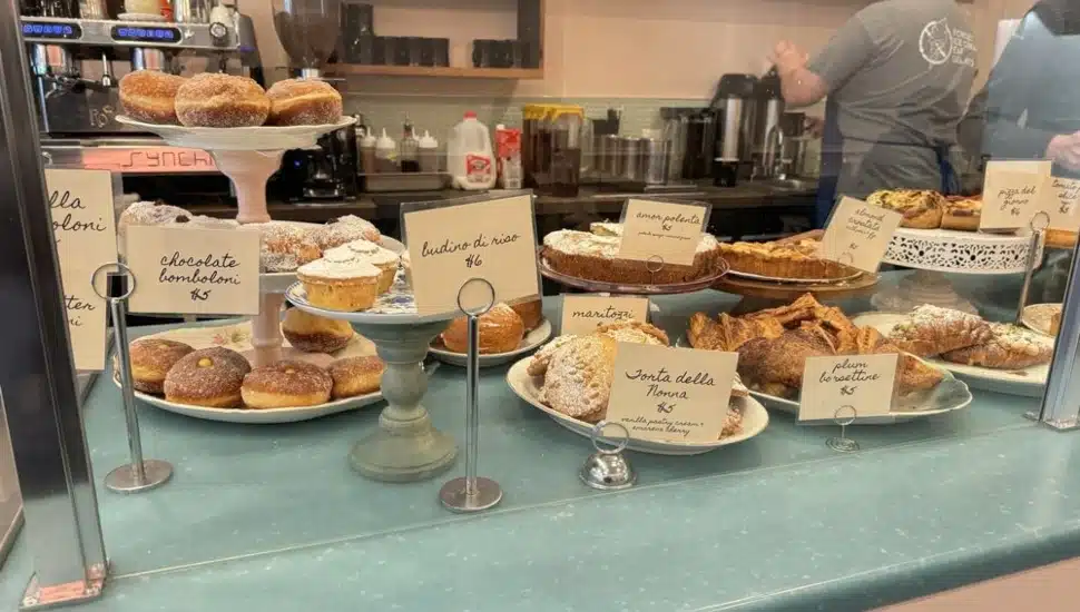 Various desserts and pastries at a window.