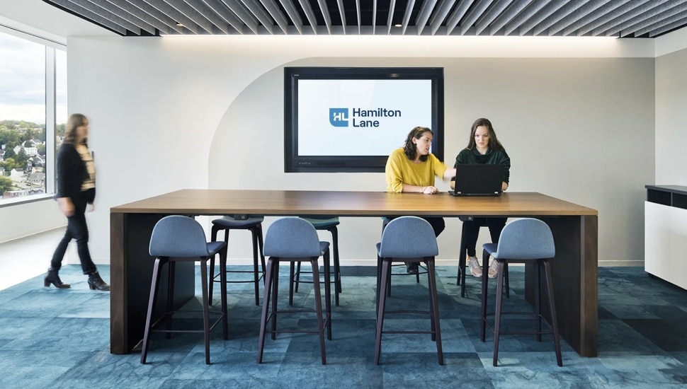 Employees inside Hamilton Lane office.