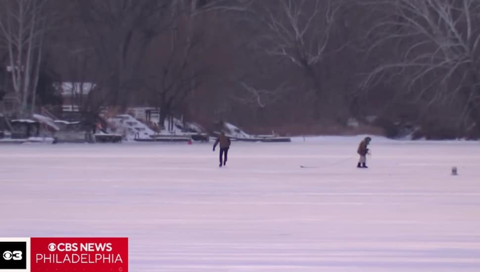 People walking on the frozen Schuylkill.