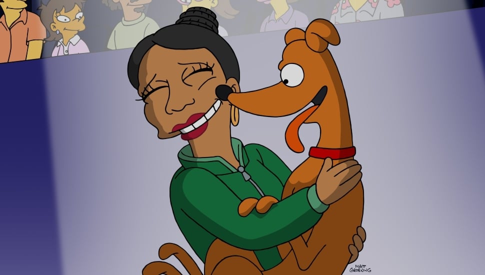 A Simpsons character voiced by Quinta Brunson embracing and being licked by Santa's Little Helper.