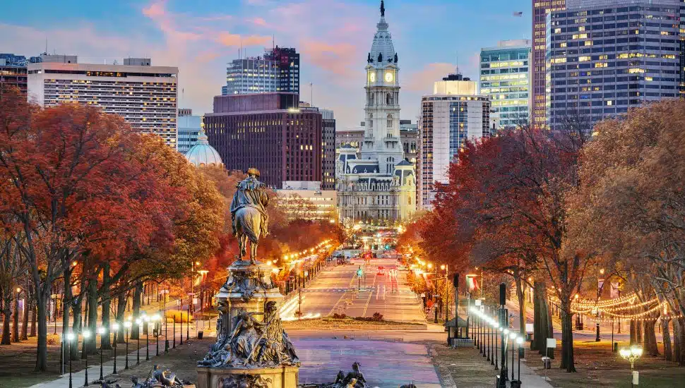 Philadelphia cityscape overlooking Benjamin Franklin Parkway at dawn in autumn season.
