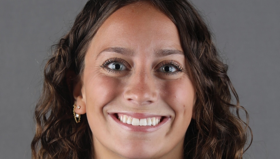 Headshot of young woman with dark hair.