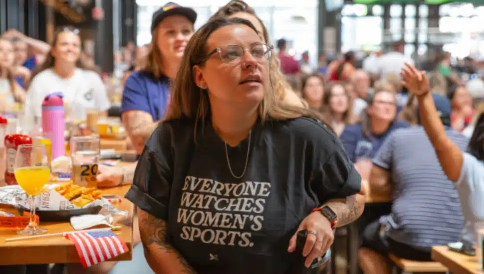 A number of women's watching women's sports.