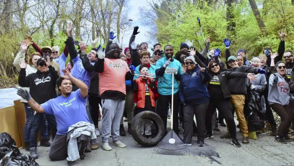 Tookany/Tacony-Frankford Watershed Partnership team and partners with rakes and trash bags.