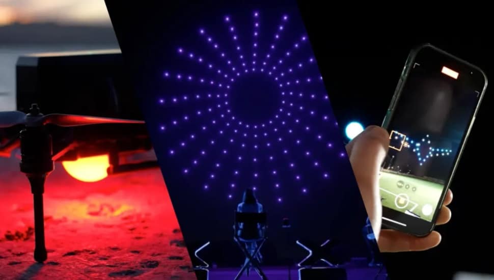A drone, a light display and someone using an app on a phone.