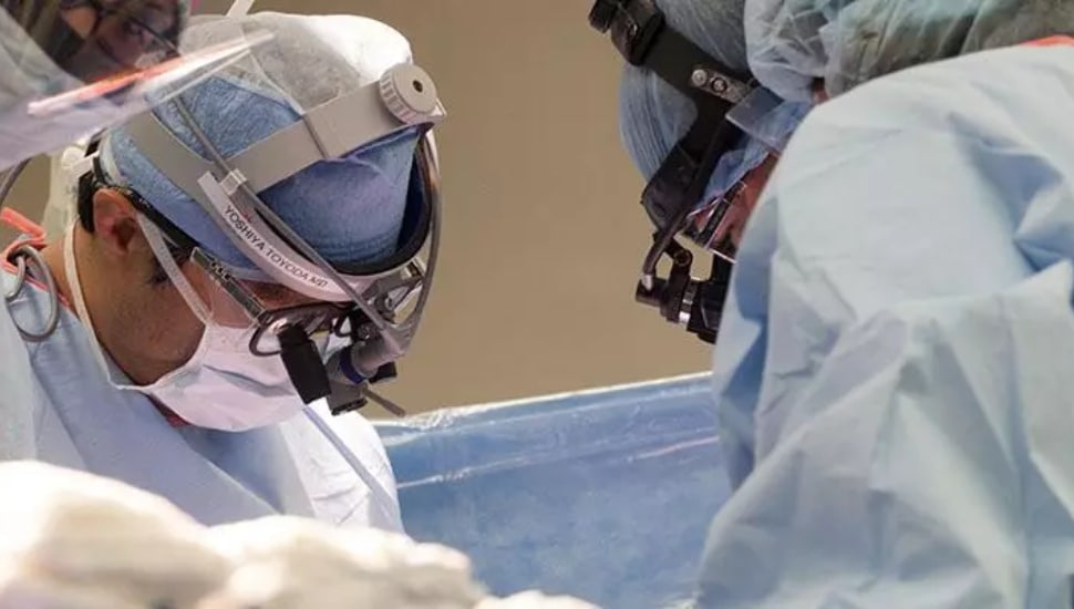 Doctors performing a heart transplant.