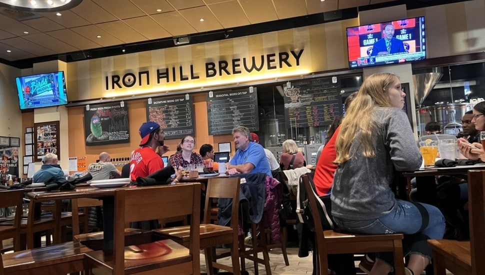 People inside Iron Hill Brewery.