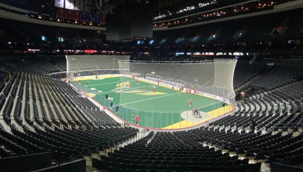 Wide-shot view of stadium with lacrosse game being played.