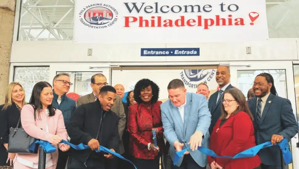 City officials cutting the ribbon inside new Philadelphia transportation cente.r
