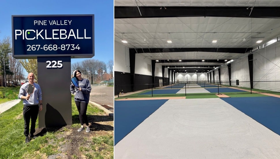 Owners of new pickleball facility stand in front of street sign.