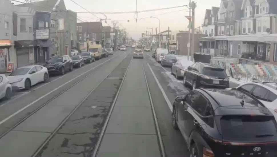 SEPTA trolley lanes and cars beside them.