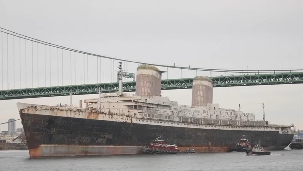 SS United States passes under the Walt Whitman Bridge.