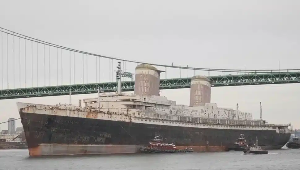 SS United States passes under the Walt Whitman Bridge.