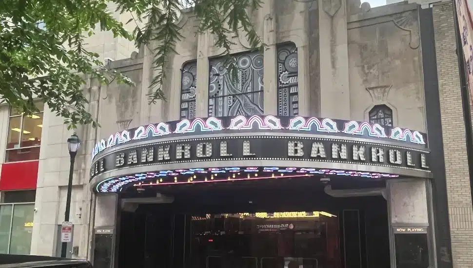 The Boyd Theatre marquee lit up with neon lights displaying "Bankroll" on Chestnut Street in Center City Philadelphia.