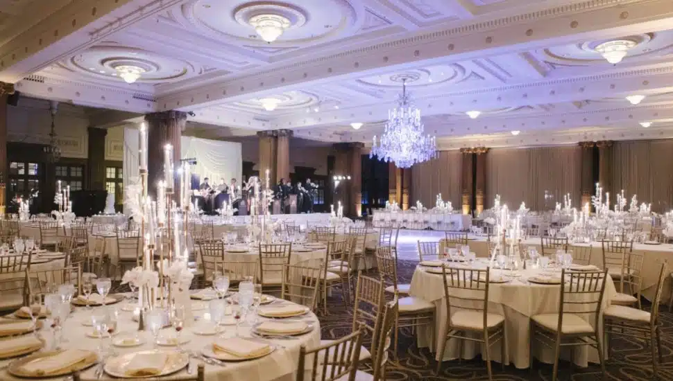 The grand ballroom of the Crystal Tea Room in Philadelphia's Wanamaker Building, elegantly set for an event by Finley Catering