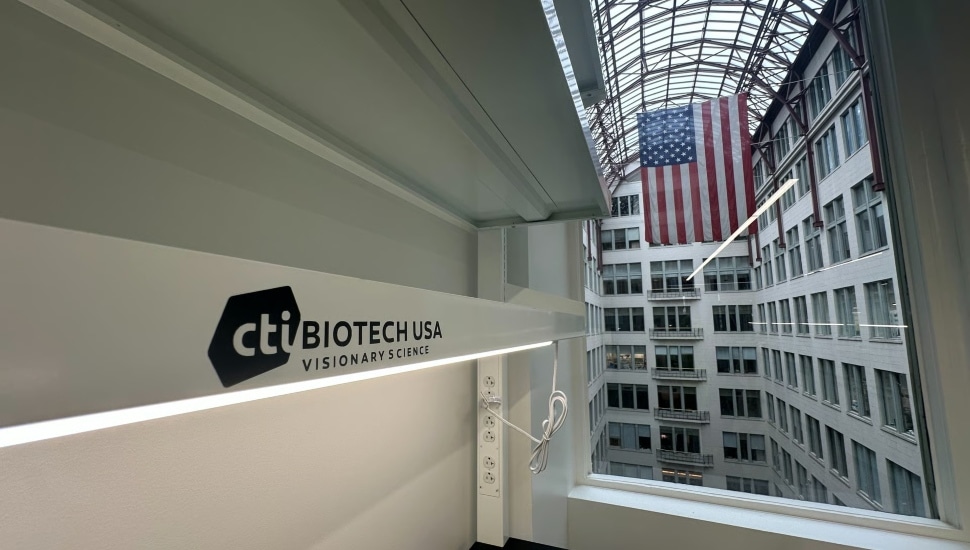 CTIBIOTECH USA office at BioLabs Philadelphia with American flag visible through atrium window.